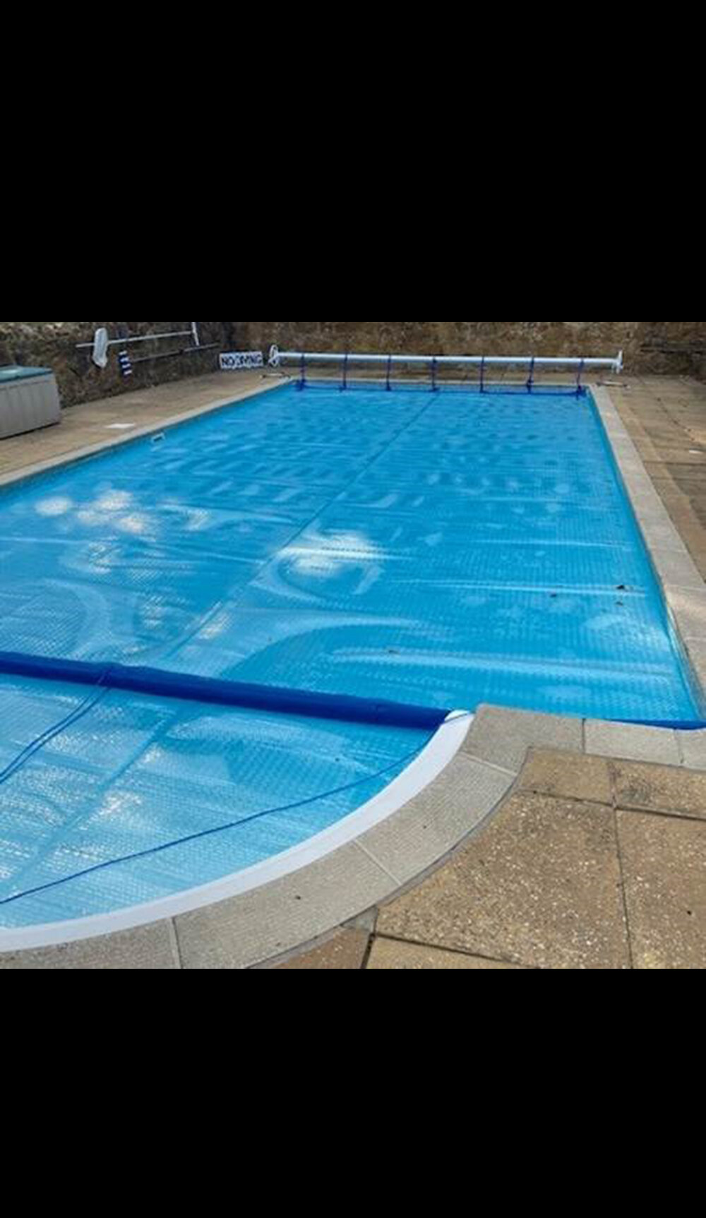 light blue cover on domestic outdoor pool