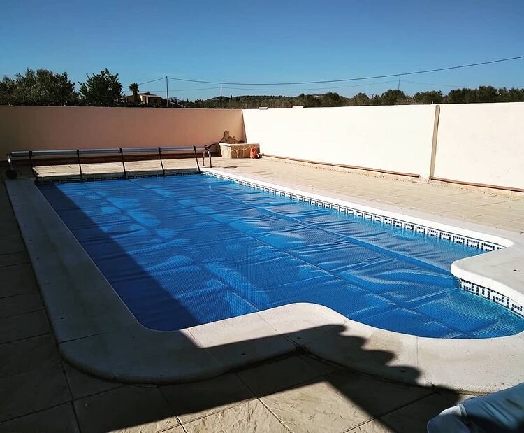 Light blue geobubble cover on swimming pool